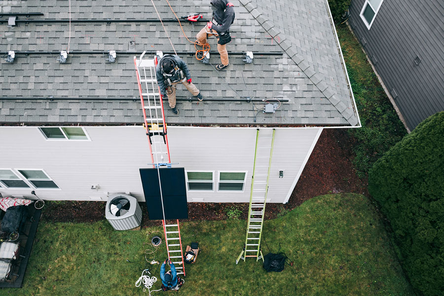 Roofers on House in Michigan