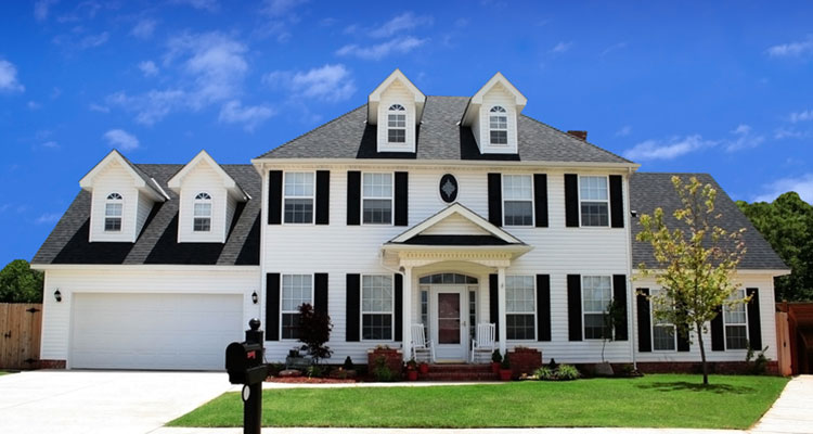 Nice home with new siding and blue sky.