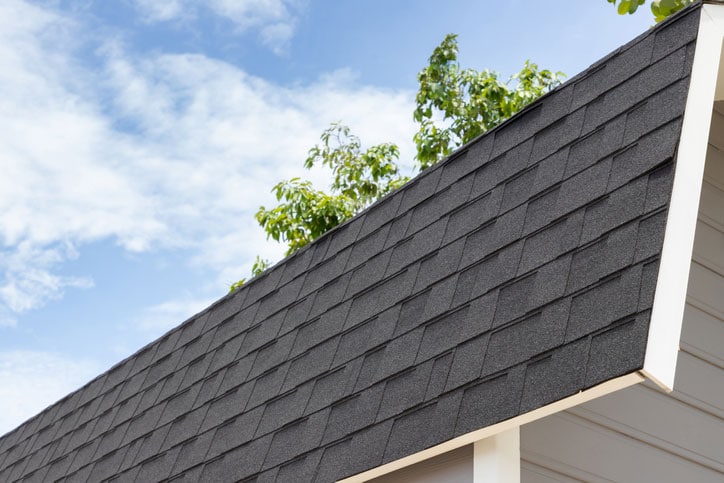 roof shingle of house with blue sky.